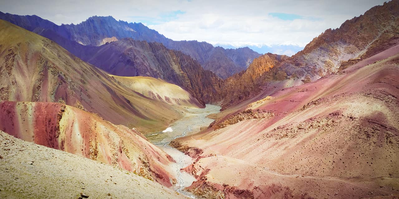 Open Ladakh valley landscape used to explain slow travel and acclimatization